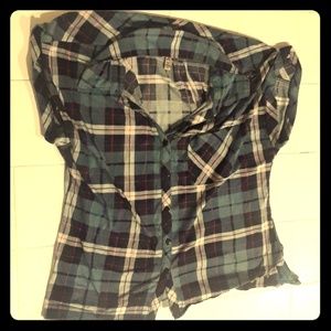 A plaid blue, pink, and white woman's shirt.